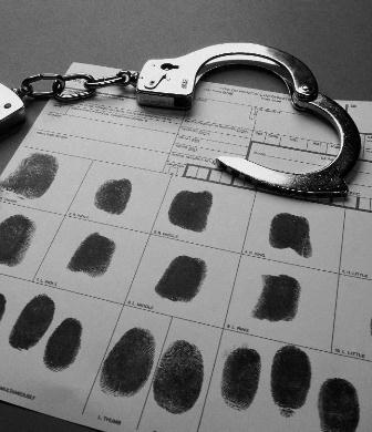 Image:  Handcuffs and fingerprints